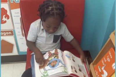 kid reading his book