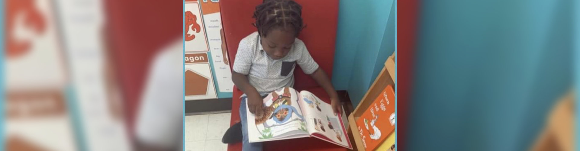 kid reading his book